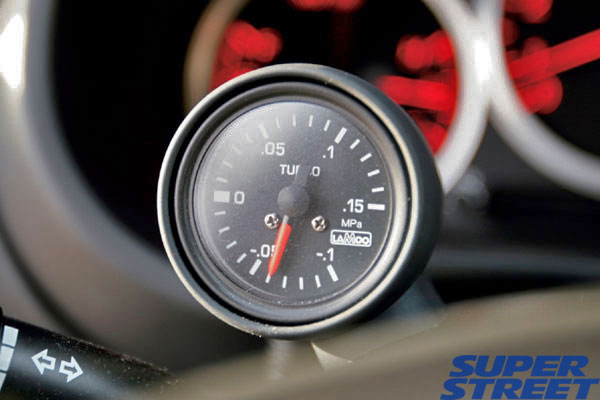 An OEM Subaru Steering Column Pod with Lamco Gauge